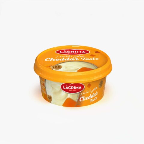 Lacrima 100g cheddar taste spreadable cheese in orange cup.